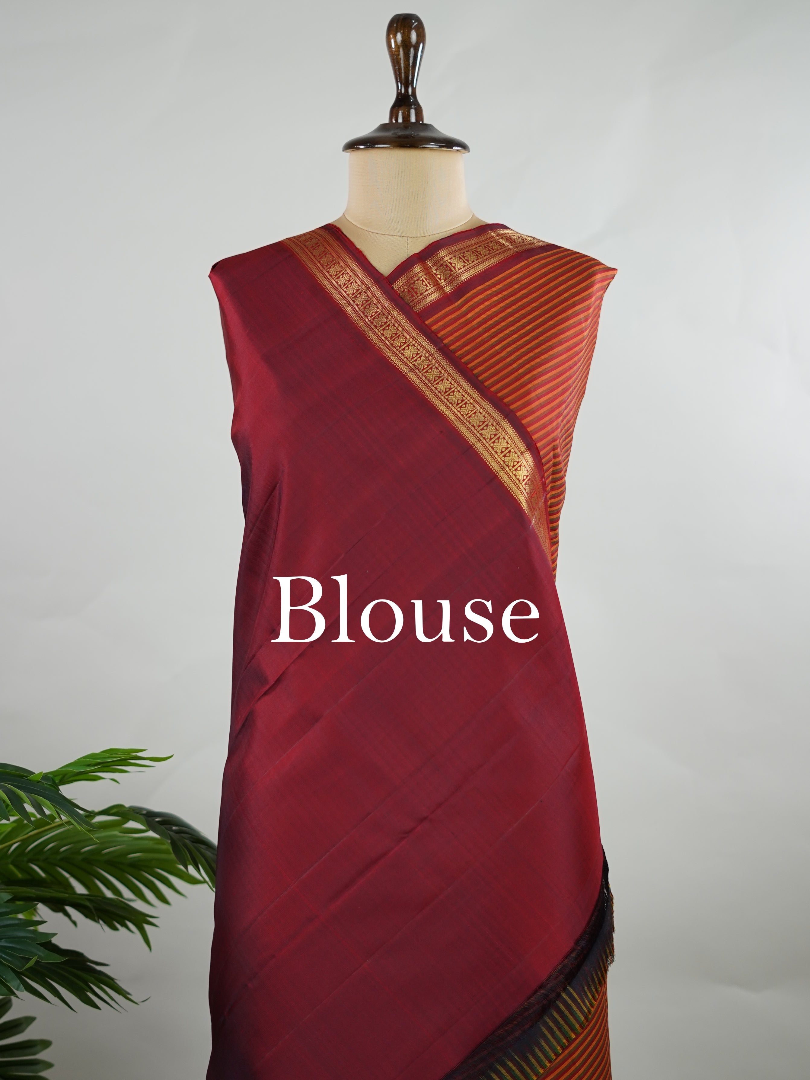 Kanchipuram Silk Multicolour handloom Kanjivaram with vibrant orange, green and maroon stripes, exuding vintage charm.
Paired with a delicate maroon border, this saree brings timeless elegance and a refined festive look. Kamakshi - Manoranjitham Weaves - Handloom Store
