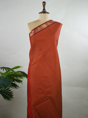 Kanchipuram Silk Multicolour handloom Kanjivaram with vibrant orange, green and maroon stripes, exuding vintage charm.
Paired with a delicate maroon border, this saree brings timeless elegance and a refined festive look. Kamakshi - Manoranjitham Weaves - Handloom Store