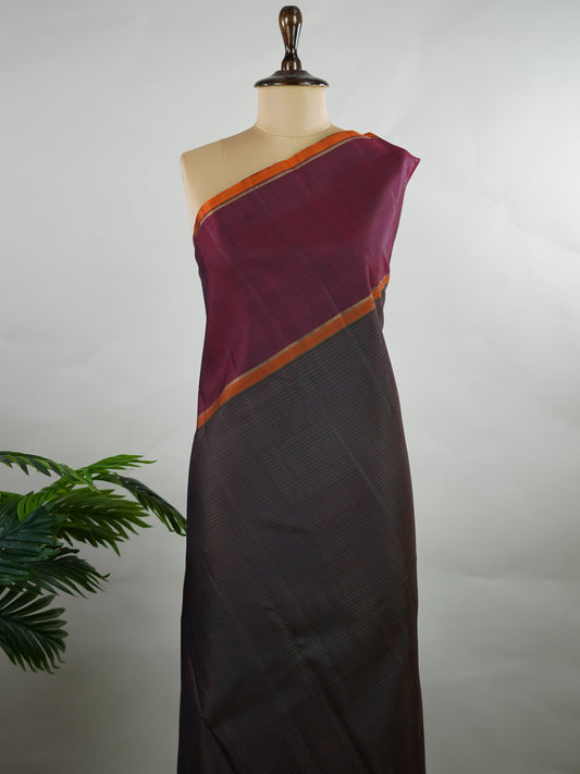 Kanchipuram Silk Green and maroon multi-stripe handloom Kanjivaram, with dancing peacock motifs above the border and a clean big-gap border design.
The maroon pallu features the classic laksha butti concept, giving it a vintage, timeless charm. Manonmani - Manoranjitham Weaves - Handloom Store
