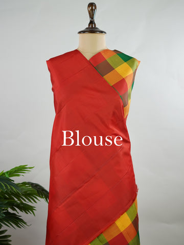 Kanchipuram Silk Borderless handloom Kanjivaram with multi-coloured checks, simple and elegant.
Complemented by a rich red pallu and blouse, perfect for a classic, timeless look. Hamsa Vahini - Manoranjitham Weaves - Handloom Store