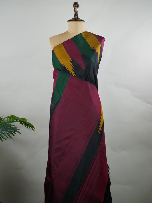 Kanchipuram Silk Woven in pure Kanjivaram silk, this saree pairs a deep black body with a rich maroon pallu and matching blouse. The multi temple borders add a subtle rhythm of tradition, lending depth without overpowering the design. A classic composition that speaks through contrast, craftsmanship, and timeless elegance. Kameshi - Manoranjitham Weaves - Handloom Store