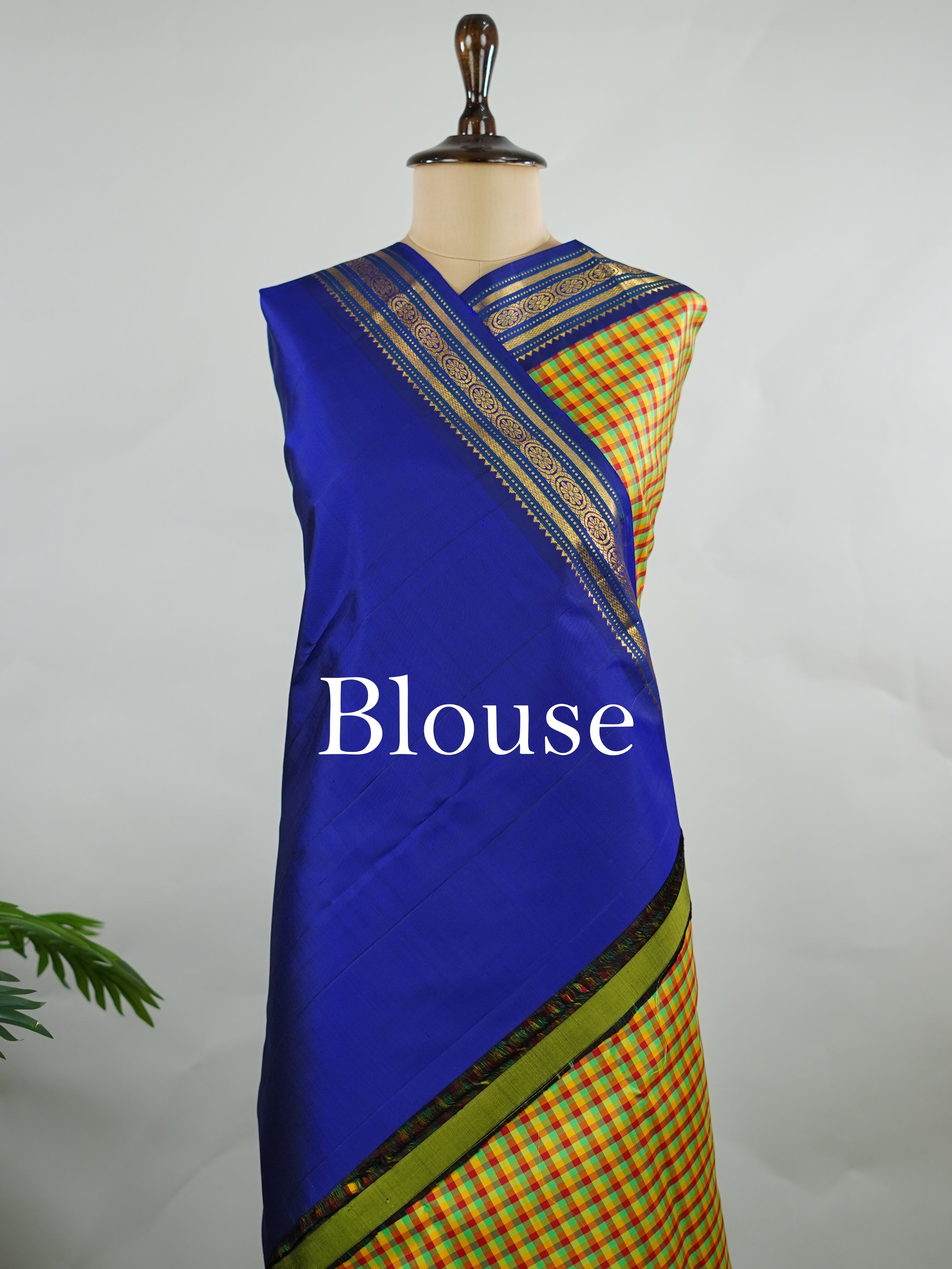 Kanchipuram Silk Pure silk woven with fine multi small checks.br
Accented with a traditional blue korvai (kuttu) border.br
Finished with a blue pallu and matching blouse for timeless elegance. Shyama - Pure Kanjivaram Silk Saree | Korvai Border - Manoranjitham Weaves - Handloom Store