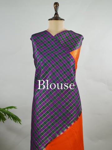 Kanchipuram Silk Pure silk in vibrant orange.
Paired with temple borders and multi-colour checked borders.
Blouse and pallu echo the same border design for a harmonious, elegant look. Kamini - Manoranjitham Weaves - Handloom Store