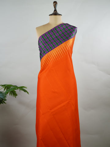 Kanchipuram Silk Pure silk in vibrant orange.
Paired with temple borders and multi-colour checked borders.
Blouse and pallu echo the same border design for a harmonious, elegant look. Kamini - Manoranjitham Weaves - Handloom Store