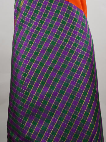 Kanchipuram Silk Pure silk in vibrant orange.
Paired with temple borders and multi-colour checked borders.
Blouse and pallu echo the same border design for a harmonious, elegant look. Kamini - Manoranjitham Weaves - Handloom Store