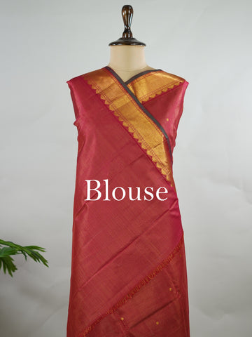 Kanchipuram Silk Pure silk in deep maroon Vairavoosi weave with delicate buttas on the body.
Paired with a rich pallu and a matching Vairavoosi blouse.
Accented with a traditional kaddi border for timeless elegance. Shobha - Manoranjitham Weaves - Handloom Store