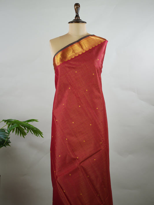 Kanchipuram Silk Pure silk in deep maroon Vairavoosi weave with delicate buttas on the body.
Paired with a rich pallu and a matching Vairavoosi blouse.
Accented with a traditional kaddi border for timeless elegance. Shobha - Manoranjitham Weaves - Handloom Store