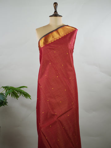 Kanchipuram Silk Pure silk in deep maroon Vairavoosi weave with delicate buttas on the body.
Paired with a rich pallu and a matching Vairavoosi blouse.
Accented with a traditional kaddi border for timeless elegance. Shobha - Manoranjitham Weaves - Handloom Store