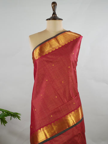 Kanchipuram Silk Pure silk in deep maroon Vairavoosi weave with delicate buttas on the body.
Paired with a rich pallu and a matching Vairavoosi blouse.
Accented with a traditional kaddi border for timeless elegance. Shobha - Manoranjitham Weaves - Handloom Store