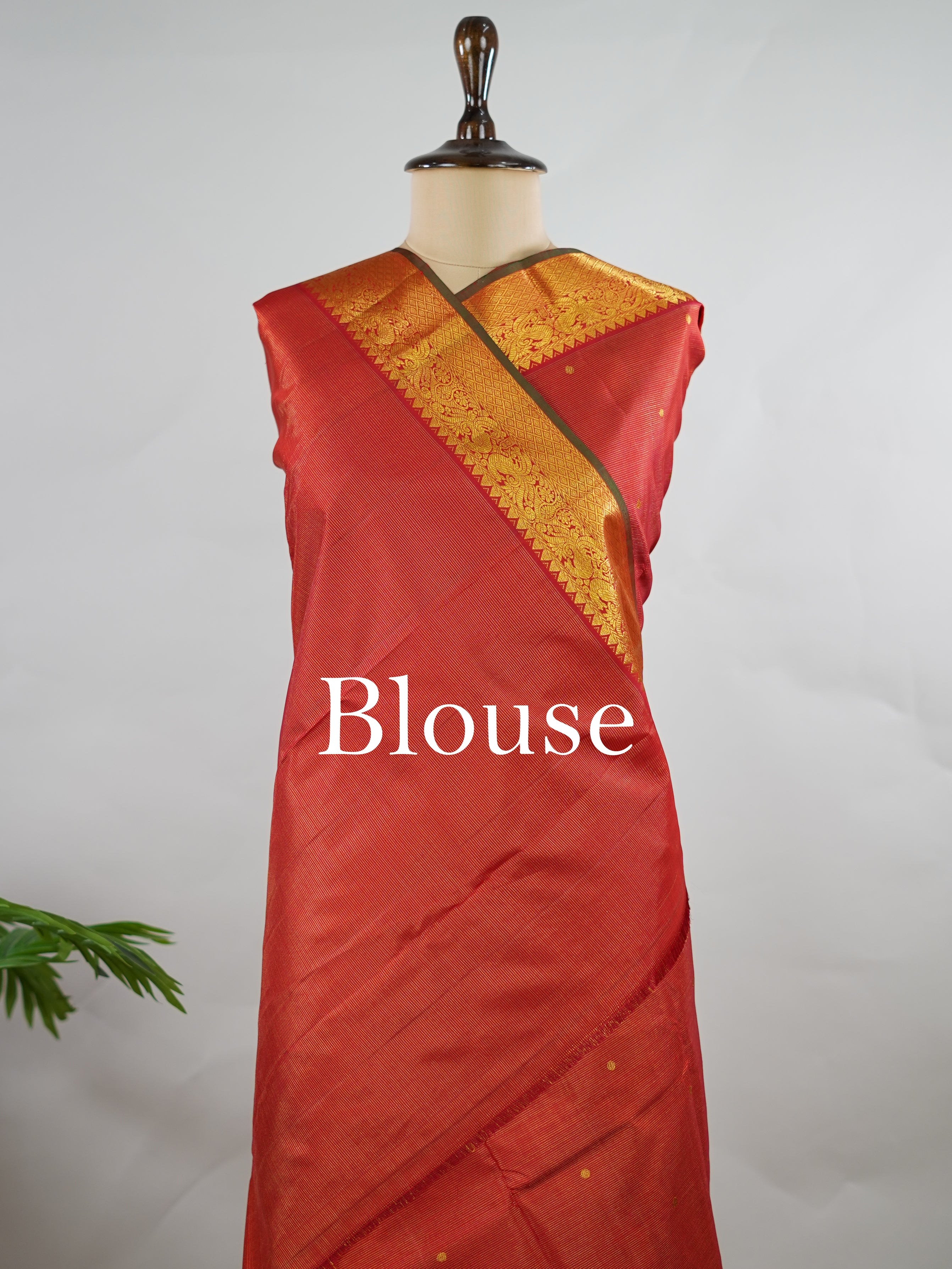 Kanchipuram Silk Pure silk in vibrant orange Vairavoosi weave with delicate buttas on the body.
Paired with a rich pallu and a matching Vairavoosi blouse.
Accented with a traditional kaddi border for timeless elegance. Shakti - Manoranjitham Weaves - Handloom Store