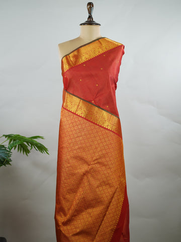 Kanchipuram Silk Pure silk in vibrant orange Vairavoosi weave with delicate buttas on the body.
Paired with a rich pallu and a matching Vairavoosi blouse.
Accented with a traditional kaddi border for timeless elegance. Shakti - Manoranjitham Weaves - Handloom Store