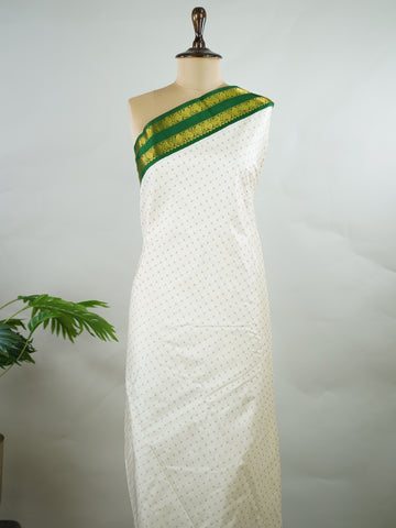 Kanchipuram Silk Pure silk with white Laksha Deepam style buttas on the body.
Paired with dual pallu in green and maroon, and a maroon blouse.
Accented with a classic Ganga-Jamuna border for timeless elegance. Sivamayi - Manoranjitham Weaves - Handloom Store