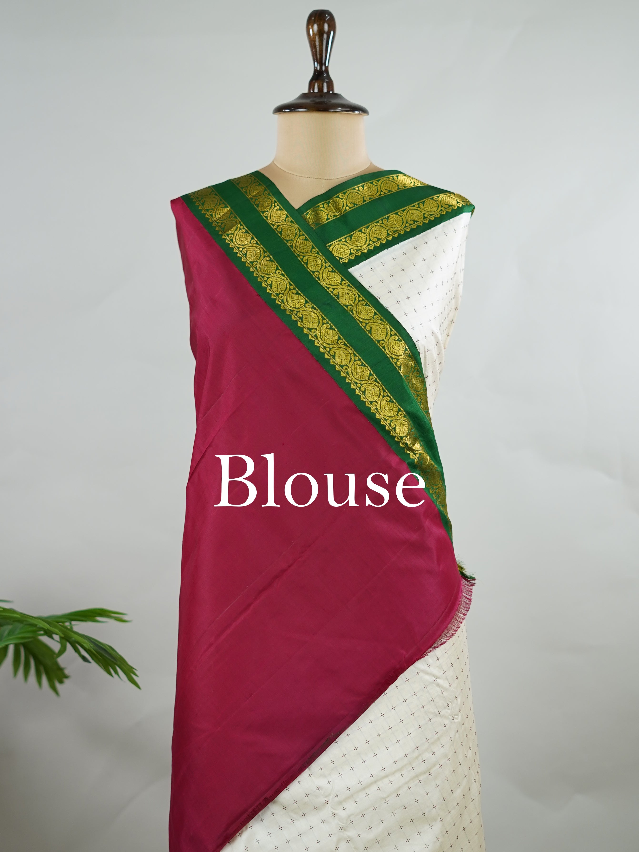 Kanchipuram Silk Pure silk with white Laksha Deepam style buttas on the body.
Paired with dual pallu in green and maroon, and a maroon blouse.
Accented with a classic Ganga-Jamuna border for timeless elegance. Sivamayi - Manoranjitham Weaves - Handloom Store