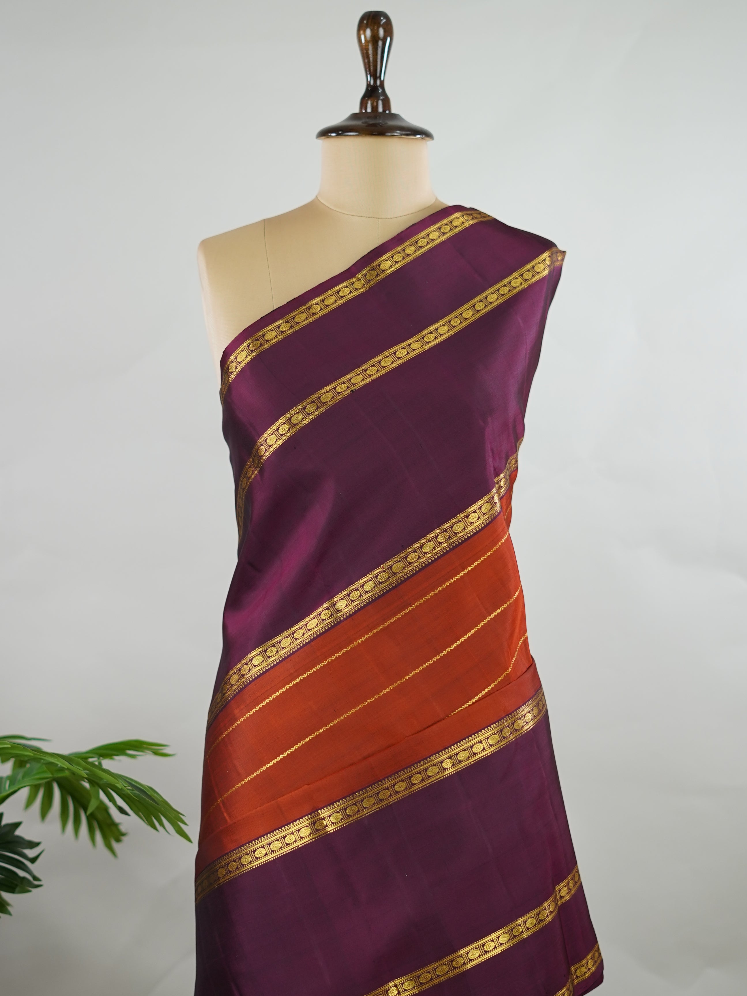 Kanchipuram Silk Pure silk in rust orange with bold horizontal stripes.br
Paired with big purple gap borders.br
A striking combination of colour and traditional craftsmanship. Kamini - Rust Orange Pure Kanjivaram Silk Saree - Manoranjitham Weaves - Handloom Store