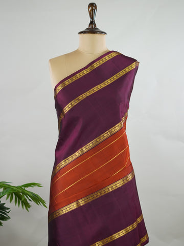 Kanchipuram Silk Pure silk in rust orange with bold horizontal stripes.br
Paired with big purple gap borders.br
A striking combination of colour and traditional craftsmanship. Kamini - Rust Orange Pure Kanjivaram Silk Saree - Manoranjitham Weaves - Handloom Store