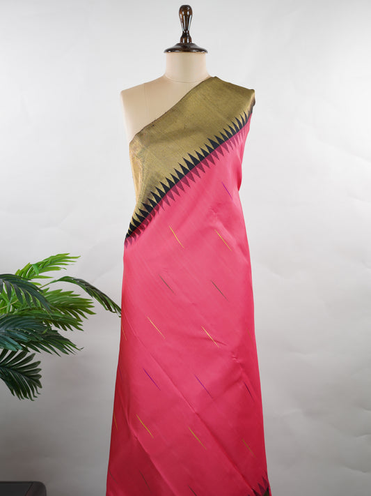 Kanchipuram Silk A stunning blend of vibrance and tradition, this magenta pink and mustard Kanjivaram saree is crafted in luxurious 100% pure silk. Adorned with elegant parrot buttis across the body, it beautifully reflects classic South Indian artistry. The bold contrast adds festive grandeur, making it a perfect pick for weddings and special celebrations. Karunamayi - Manoranjitham Weaves - Handloom Store