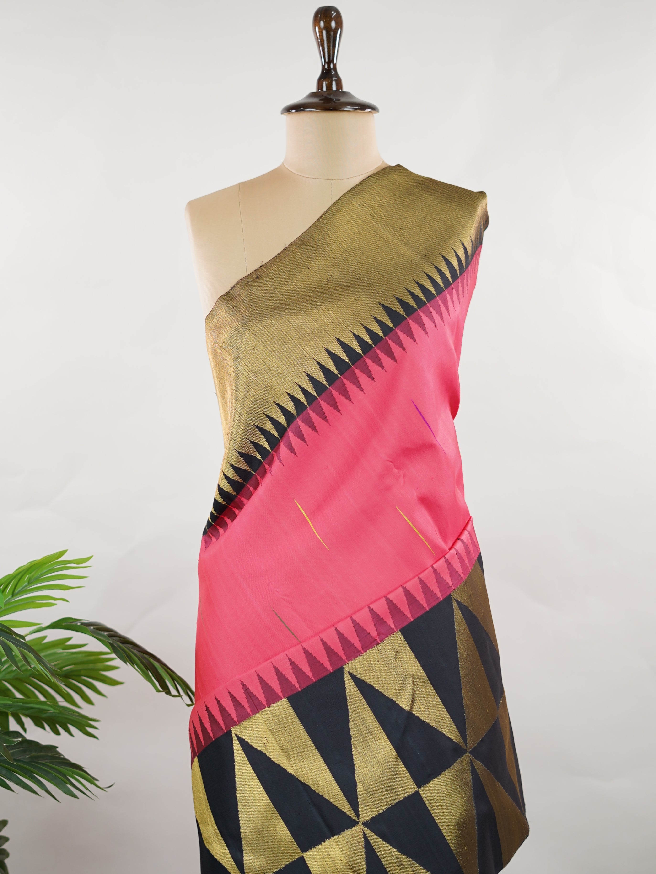 Kanchipuram Silk A stunning blend of vibrance and tradition, this magenta pink and mustard Kanjivaram saree is crafted in luxurious 100% pure silk. Adorned with elegant parrot buttis across the body, it beautifully reflects classic South Indian artistry. The bold contrast adds festive grandeur, making it a perfect pick for weddings and special celebrations. Karunamayi - Mustard Pure Kanjivaram Silk Saree - Manoranjitham Weaves - Handloom Store