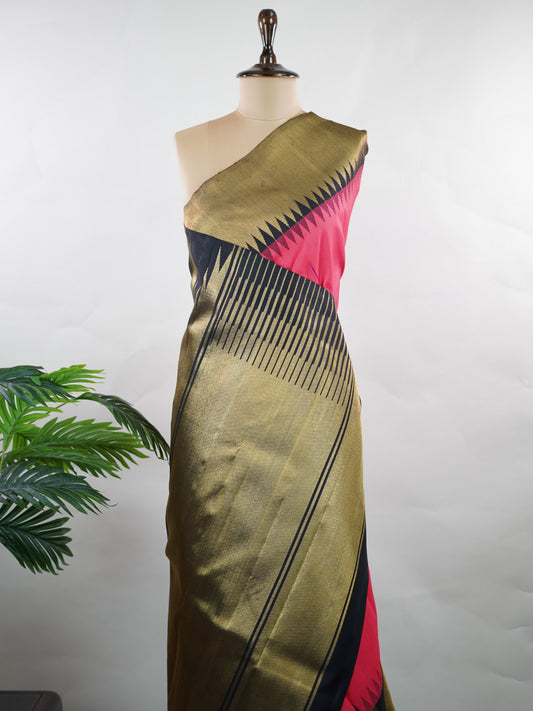 Kanchipuram Silk A stunning blend of vibrance and tradition, this magenta pink and mustard Kanjivaram saree is crafted in luxurious 100% pure silk. Adorned with elegant parrot buttis across the body, it beautifully reflects classic South Indian artistry. The bold contrast adds festive grandeur, making it a perfect pick for weddings and special celebrations. Karunamayi - Manoranjitham Weaves - Handloom Store