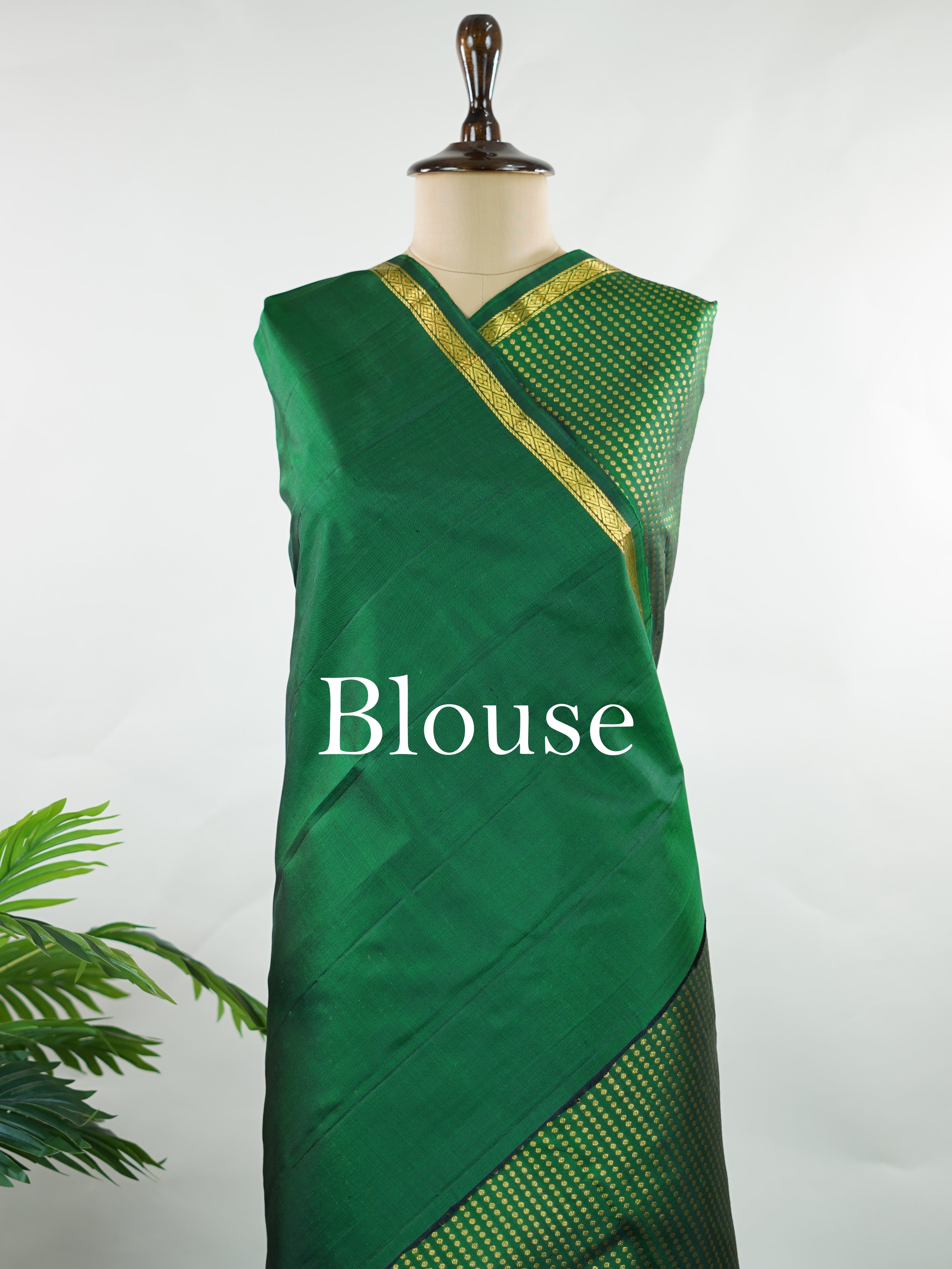 Kanchipuram Silk Crafted in luxurious 100% pure silk, this elegant green Kanjivaram saree is a timeless classic. The body is adorned with delicate small buttis that add subtle charm and richness to the weave. Perfect for weddings, festive occasions, and special celebrations, it drapes beautifully with a regal yet graceful appeal. Shivapriya - Green Pure Kanjivaram Silk Saree - Manoranjitham Weaves - Handloom Store