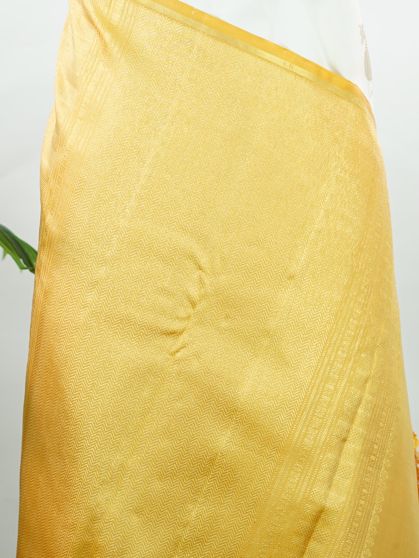 Kanchipuram Silk Elegant and refreshing, this white and yellow Kanjivaram saree is woven in luxurious 100% pure silk for a rich, graceful drape. The body features charming parrot motifs that stand out beautifully against the soft contrast tones. Designed without a traditional border, it offers a modern, seamless look while retaining the timeless grandeur of classic Kanjivaram craftsmanship. Tripurasundari - Yellow Pure Kanjivaram Silk Saree - Manoranjitham Weaves - Handloom Store
