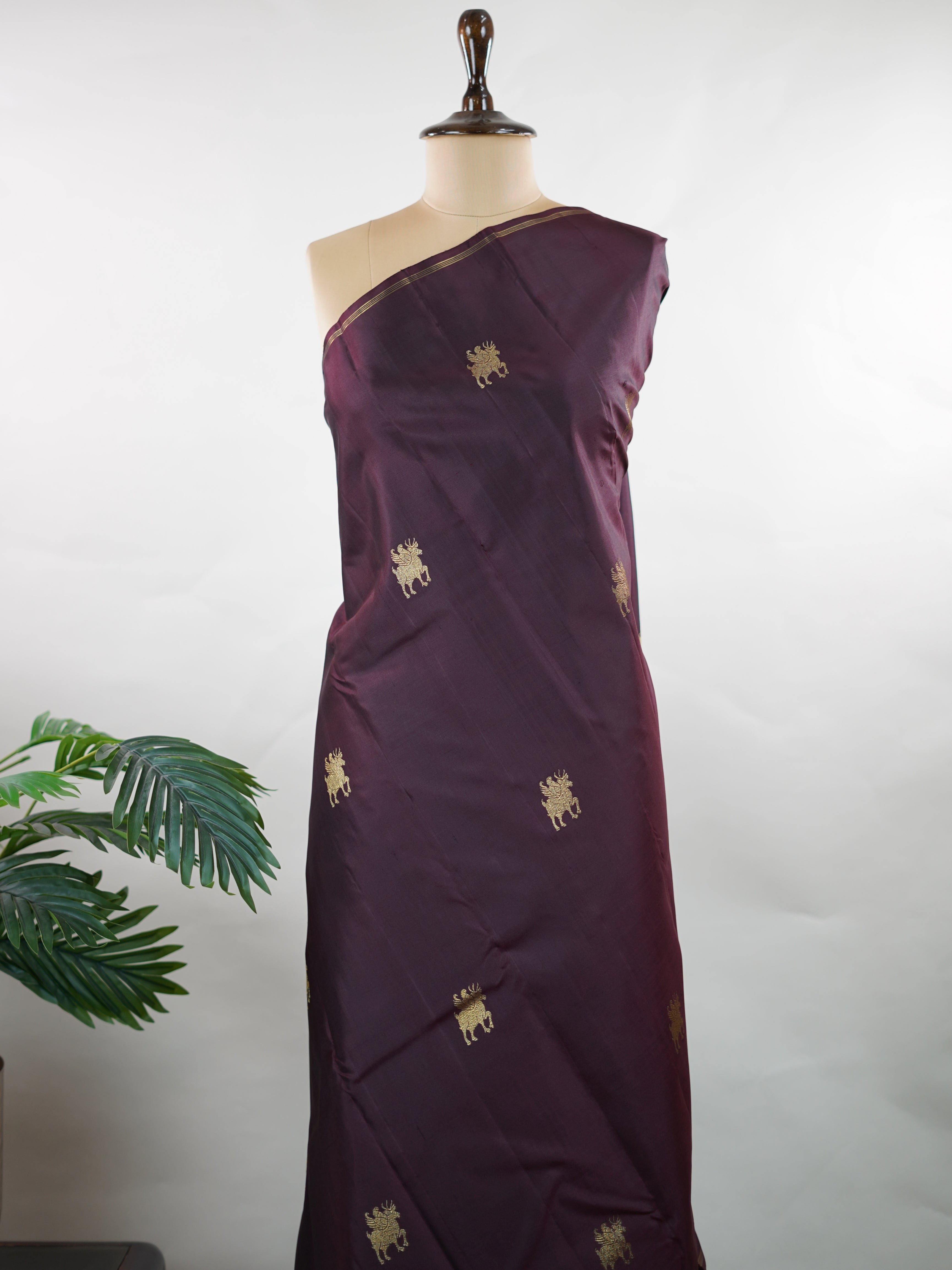 Kanchipuram Silk Rich and earthy, this snuff-toned Kanjivaram saree is crafted in luxurious 100% pure silk for a graceful, structured drape. The body is adorned with elegant buttas that add depth and traditional charm to the weave. Subtle yet regal, it’s a timeless choice for weddings, festive occasions, and classic celebrations. Adishakti - Pure Kanjivaram Silk Saree | Pure Zari - Manoranjitham Weaves - Handloom Store