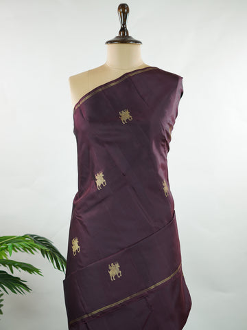 Kanchipuram Silk Rich and earthy, this snuff-toned Kanjivaram saree is crafted in luxurious 100% pure silk for a graceful, structured drape. The body is adorned with elegant buttas that add depth and traditional charm to the weave. Subtle yet regal, it’s a timeless choice for weddings, festive occasions, and classic celebrations. Adishakti - Pure Kanjivaram Silk Saree | Pure Zari - Manoranjitham Weaves - Handloom Store