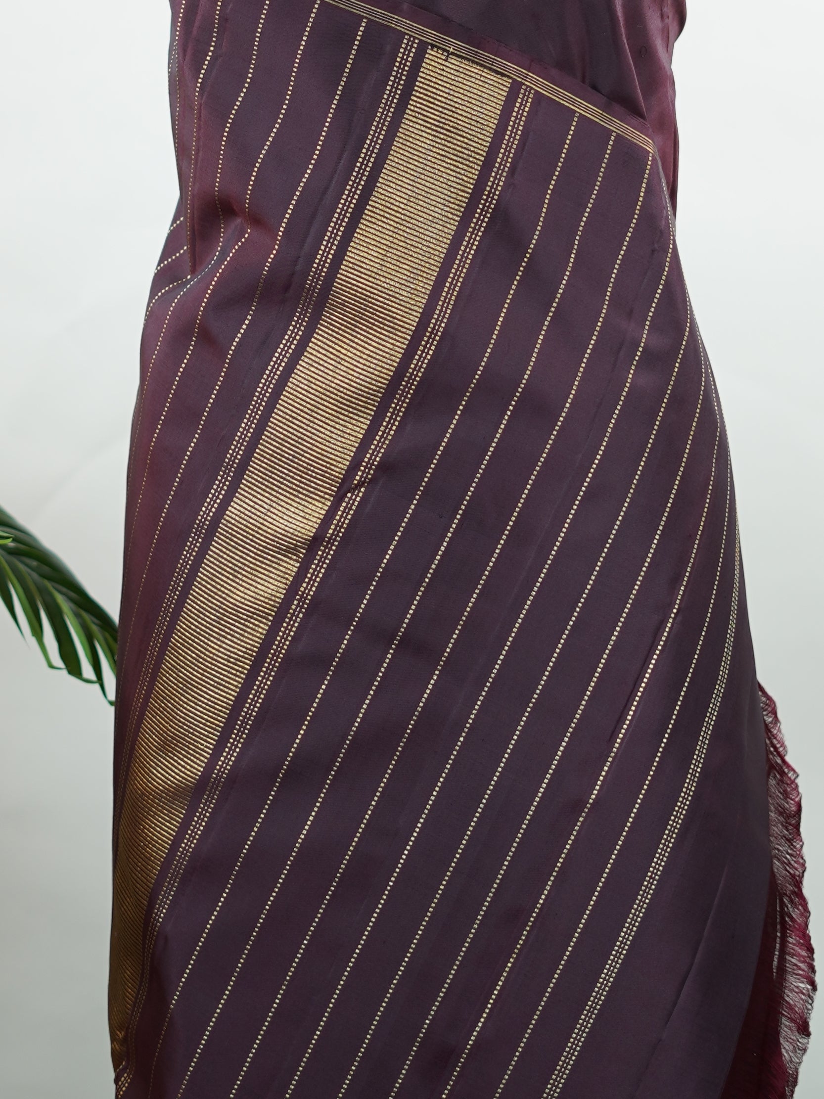 Kanchipuram Silk Rich and earthy, this snuff-toned Kanjivaram saree is crafted in luxurious 100% pure silk for a graceful, structured drape. The body is adorned with elegant buttas that add depth and traditional charm to the weave. Subtle yet regal, it’s a timeless choice for weddings, festive occasions, and classic celebrations. Adishakti - Pure Kanjivaram Silk Saree | Pure Zari - Manoranjitham Weaves - Handloom Store