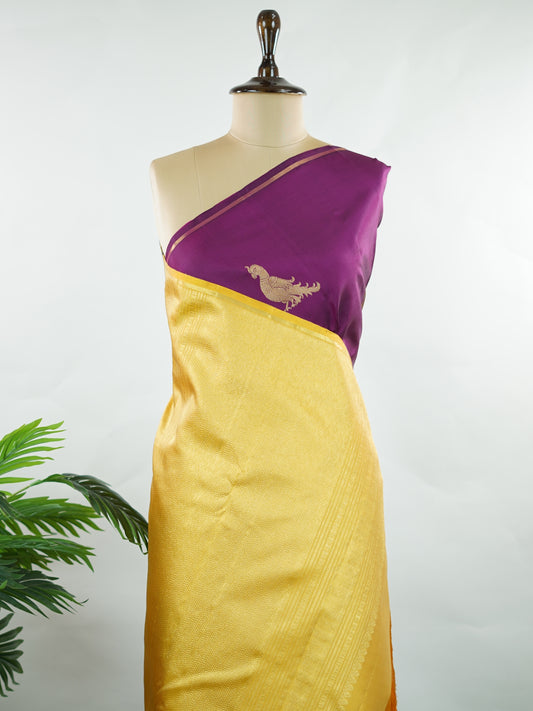 Kanchipuram Silk Vibrant and eye-catching, this magenta pink and mustard Kanjivaram saree is woven in luxurious 100% pure silk for a rich, graceful drape. The body is beautifully adorned with charming parrot buttis, adding a playful yet traditional touch to the design. Bold in contrast and timeless in appeal, it’s perfect for weddings, festive celebrations, and grand occasions Chandrakala - Manoranjitham Weaves - Handloom Store