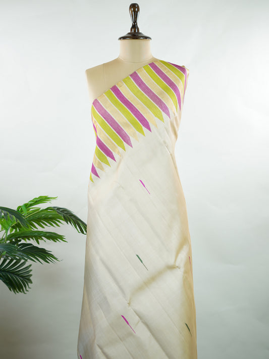 Kanchipuram Silk Soft, elegant, and timeless, this cream Kanjivaram saree is crafted in luxurious 100% pure silk for a graceful drape. The vibrant 8-kol multi-colour detailing adds festive richness, while delicate Malli Mogga buttis enhance the body with subtle floral charm. A perfect harmony of tradition and colour—ideal for weddings and special celebrations. Srishti - Manoranjitham Weaves - Handloom Store