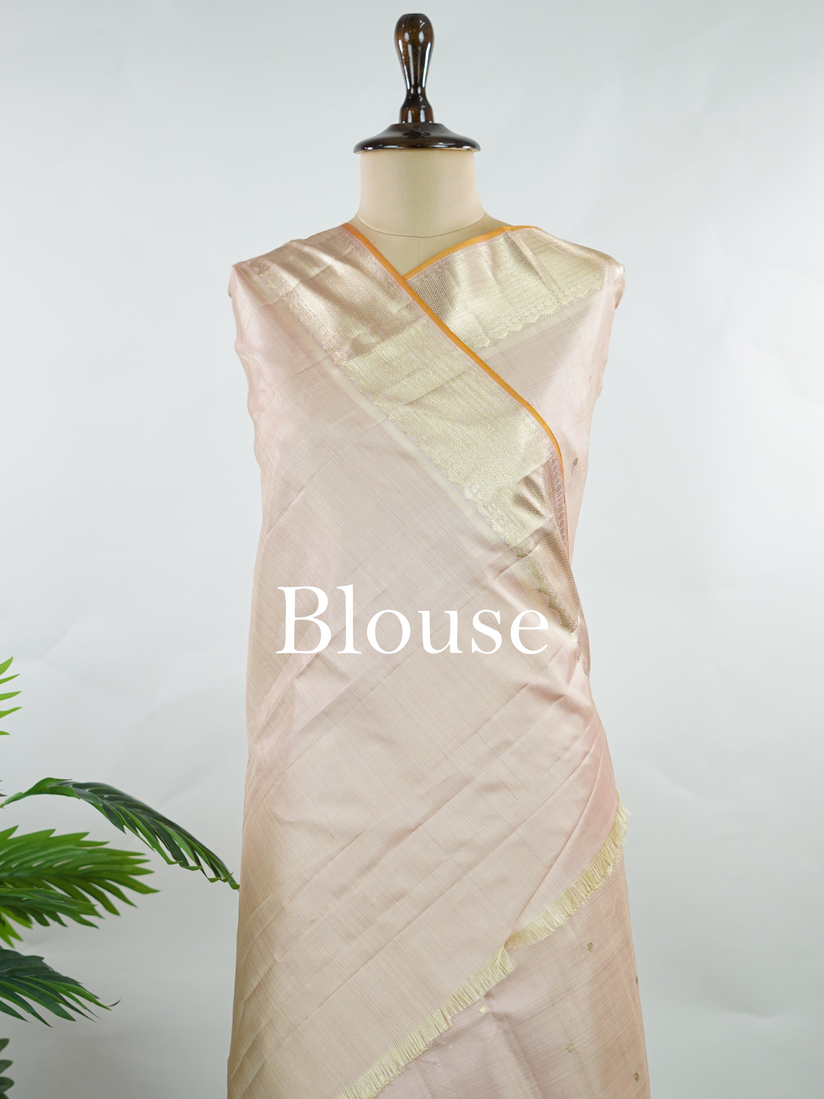 Kanchipuram Silk Understated and elegant, this cream Kanjivaram saree is woven in luxurious 100% pure silk for a soft, graceful drape. Featuring classic Vairavoosi weaving complemented by delicate buttis across the body, it reflects timeless craftsmanship with subtle richness. A refined choice for weddings, traditional gatherings, and serene festive moments. Anandalahari - Cream Pure Kanjivaram Silk Saree - Manoranjitham Weaves - Handloom Store