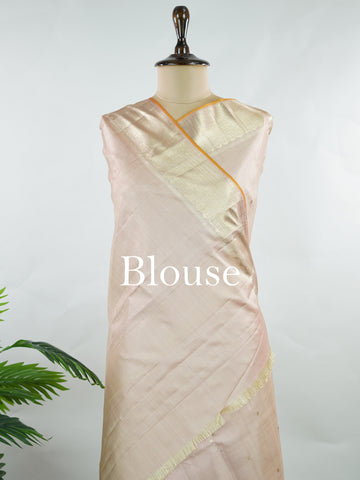 Kanchipuram Silk Understated and elegant, this cream Kanjivaram saree is woven in luxurious 100% pure silk for a soft, graceful drape. Featuring classic Vairavoosi weaving complemented by delicate buttis across the body, it reflects timeless craftsmanship with subtle richness. A refined choice for weddings, traditional gatherings, and serene festive moments. Anandalahari - Cream Pure Kanjivaram Silk Saree - Manoranjitham Weaves - Handloom Store