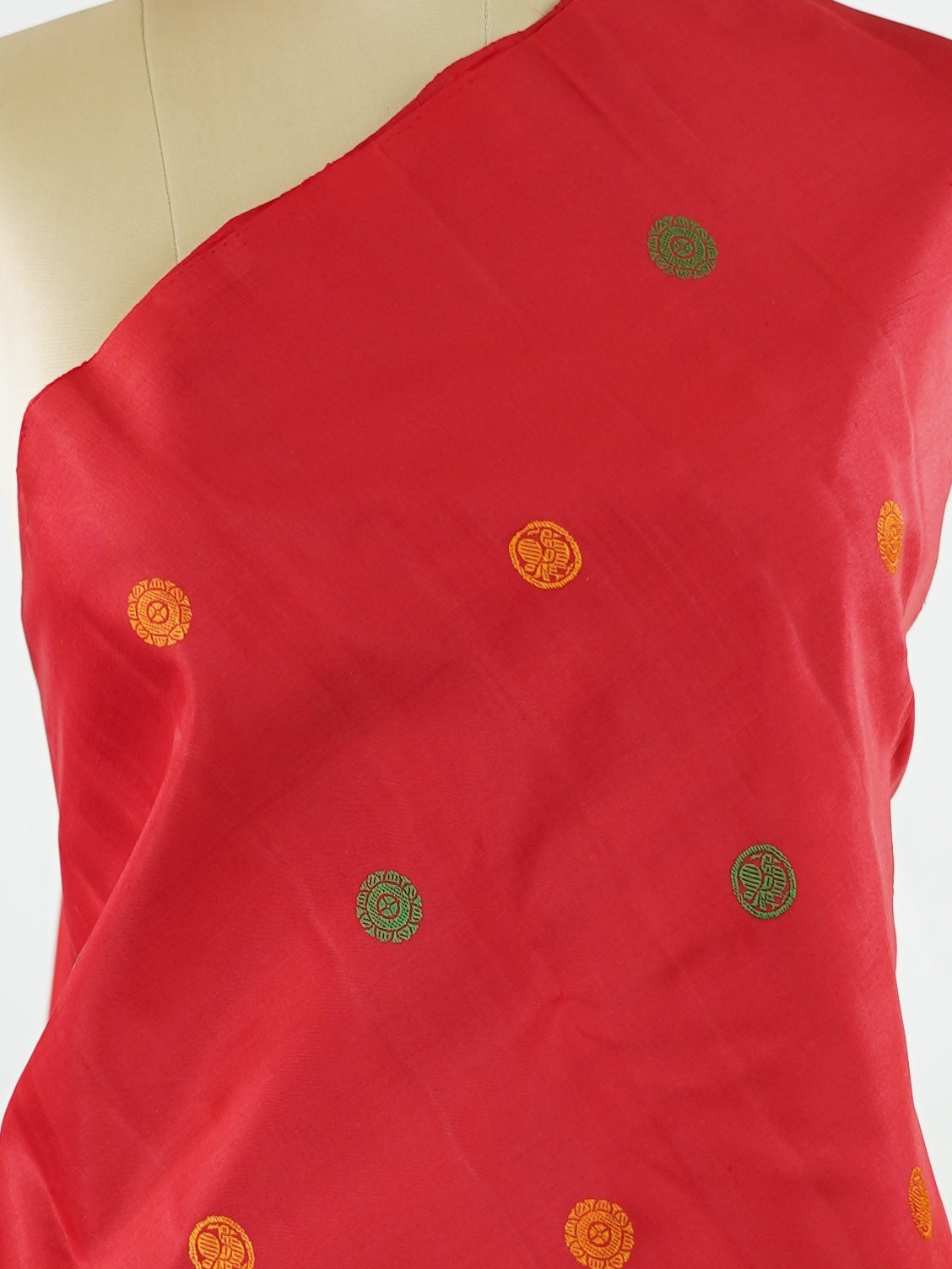 Kanchipuram Silk Bold and timeless, this red Kanjivaram saree is crafted in luxurious 100% pure silk for a rich, structured drape. Designed without zari, it features elegant resham buttas woven all over the body, creating refined texture with subtle sophistication. A perfect blend of tradition and minimal elegance—ideal for weddings, festive occasions, and classic celebrations. Devipriya - Red Pure Kanjivaram Silk Saree - Manoranjitham Weaves - Handloom Store
