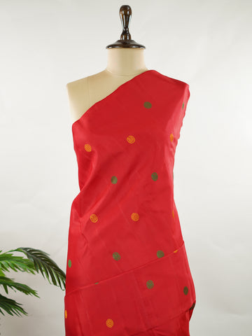Kanchipuram Silk Bold and timeless, this red Kanjivaram saree is crafted in luxurious 100% pure silk for a rich, structured drape. Designed without zari, it features elegant resham buttas woven all over the body, creating refined texture with subtle sophistication. A perfect blend of tradition and minimal elegance—ideal for weddings, festive occasions, and classic celebrations. Devipriya - Red Pure Kanjivaram Silk Saree - Manoranjitham Weaves - Handloom Store