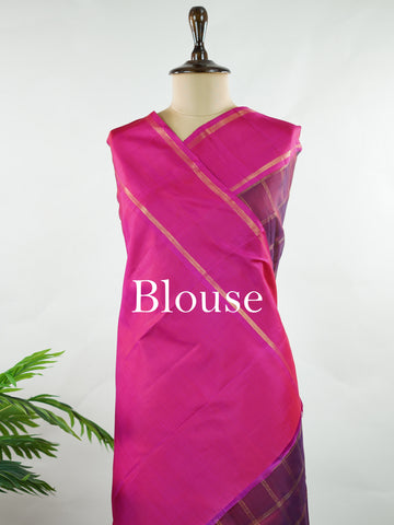 Kanchipuram Silk Rich and regal, this maroon Kanjivaram saree is crafted in luxurious 100% pure silk. The bold big checks create a striking traditional pattern, beautifully complemented by a contrasting pink gatti border. A grand and timeless choice for weddings and festive occasions. Shivaduti - Maroon Pure Kanjivaram Silk Saree | Classic Checks - Manoranjitham Weaves - Handloom Store