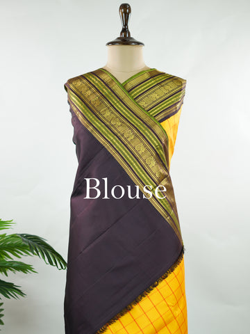 Kanchipuram Silk Bright and earthy in contrast, this yellow Kanjivaram saree features classic checks that enhance its traditional charm. The snuff-toned gatti border adds depth and definition, making it a vibrant yet elegant pick for celebrations and special gatherings Nityakalyani - Manoranjitham Weaves - Handloom Store