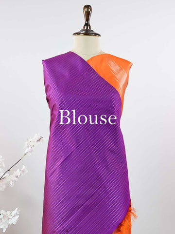Kanchipuram Silk Striking and festive, this orange Kanjivaram saree is enhanced with rich purple contrast and detailed 8-kol borders. The luxurious silk drape and vibrant colour pairing make it an ideal choice for weddings and grand celebrations. Keertana - Orange Pure Kanjivaram Silk Saree - Manoranjitham Weaves - Handloom Store