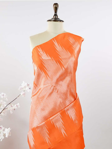 Kanchipuram Silk Striking and festive, this orange Kanjivaram saree is enhanced with rich purple contrast and detailed 8-kol borders. The luxurious silk drape and vibrant colour pairing make it an ideal choice for weddings and grand celebrations. Keertana - Orange Pure Kanjivaram Silk Saree - Manoranjitham Weaves - Handloom Store