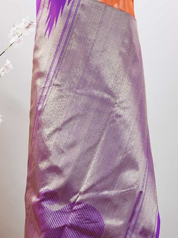 Kanchipuram Silk Striking and festive, this orange Kanjivaram saree is enhanced with rich purple contrast and detailed 8-kol borders. The luxurious silk drape and vibrant colour pairing make it an ideal choice for weddings and grand celebrations. Keertana - Orange Pure Kanjivaram Silk Saree - Manoranjitham Weaves - Handloom Store