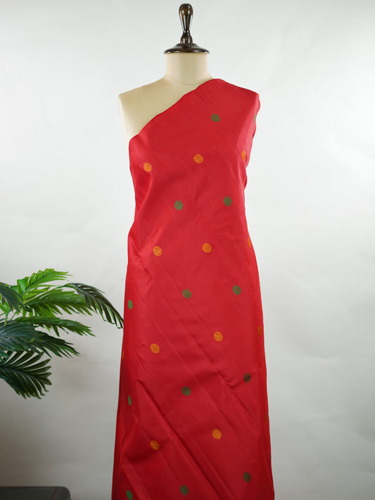 Kanchipuram Silk Bold and timeless, this red Kanjivaram saree is crafted in luxurious 100% pure silk for a rich, structured drape. Designed without zari, it features elegant resham buttas woven all over the body, creating refined texture with subtle sophistication. A perfect blend of tradition and minimal elegance—ideal for weddings, festive occasions, and classic celebrations. Devipriya - Manoranjitham Weaves - Handloom Store