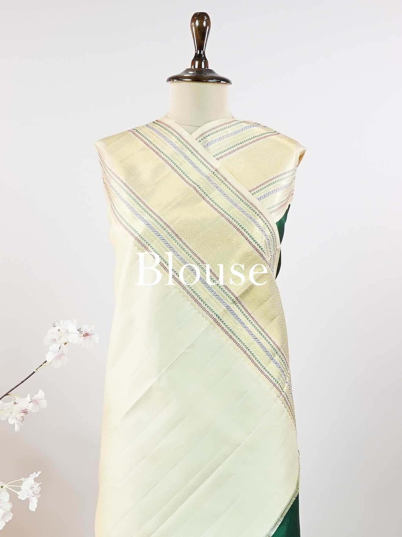 Kanchipuram Silk This beautiful Kanjivaram saree features a green body paired with a cream border, crafted from 100% pure silk.br
The body is adorned with intricate Irutali Pakshi (two-headed Ganda Beruda) motifs, showcasing traditional handloom artistry.br
Finished with elegant cream borders, it exudes timeless charm and classic Kanchipuram craftsmanship. Padmaragini - Green Pure Kanjivaram Silk Saree - Manoranjitham Weaves - Handloom Store
