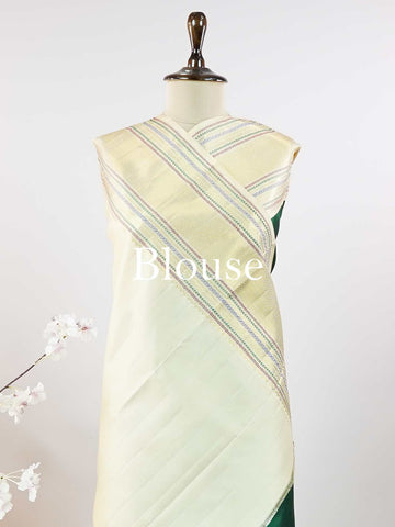 Kanchipuram Silk This beautiful Kanjivaram saree features a green body paired with a cream border, crafted from 100% pure silk.br
The body is adorned with intricate Irutali Pakshi (two-headed Ganda Beruda) motifs, showcasing traditional handloom artistry.br
Finished with elegant cream borders, it exudes timeless charm and classic Kanchipuram craftsmanship. Padmaragini - Green Pure Kanjivaram Silk Saree - Manoranjitham Weaves - Handloom Store