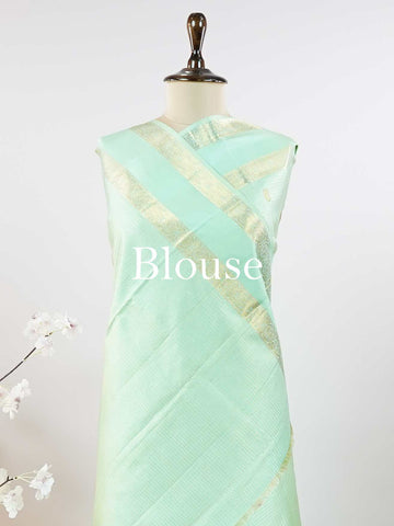 Kanchipuram Silk This elegant Kanjivaram saree in mint green is crafted from 100% pure silk for a luxurious feel.br
Featuring traditional Oosi Kattam—zari checks with buttas—on the body, it showcases exquisite handloom artistry.br
The matching mint green saree is finished with a subtle gap border, adding understated charm and elegance. Chidrupini - Mint Green Pure Kanjivaram Silk Saree - Manoranjitham Weaves - Handloom Store