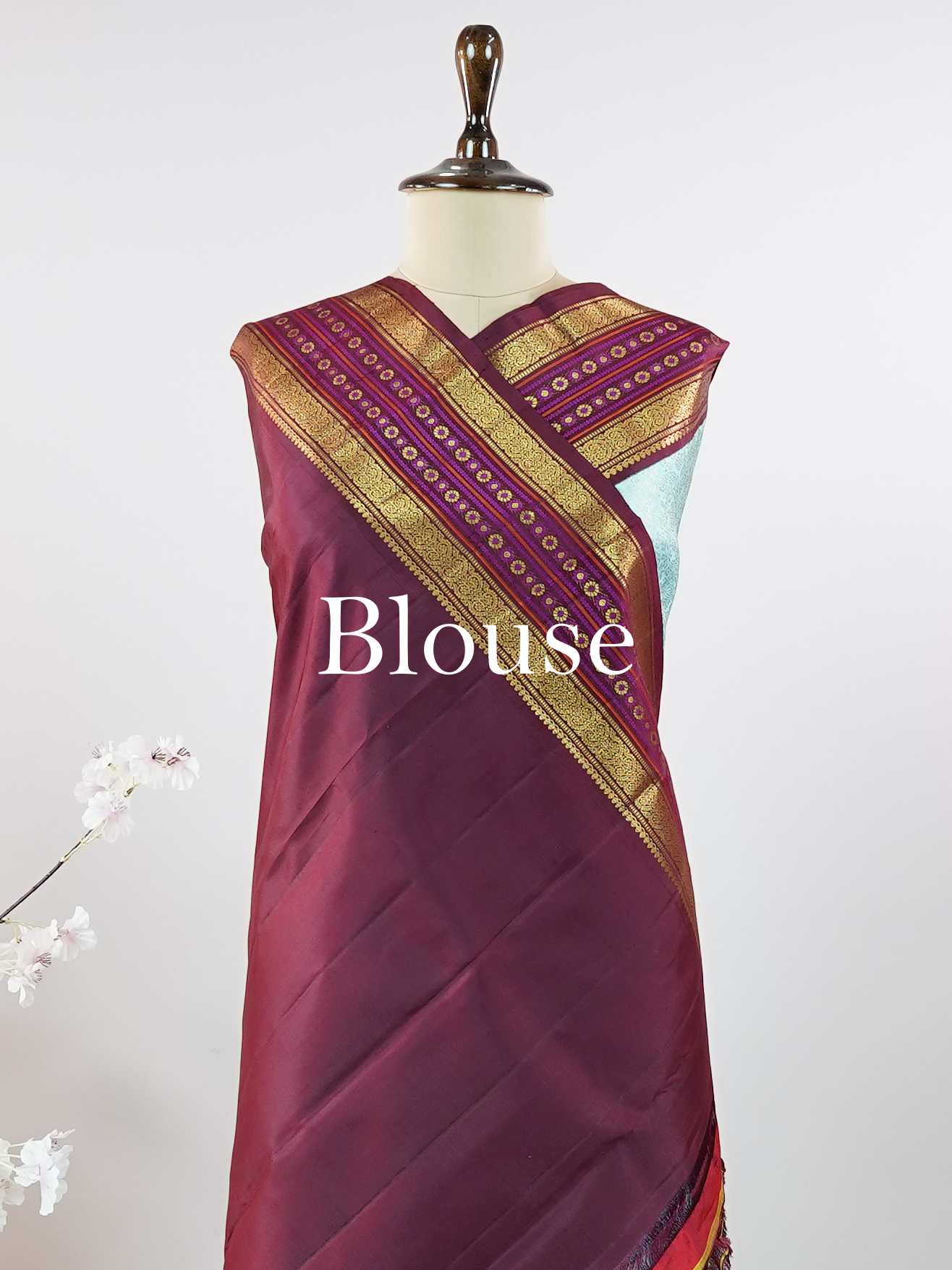 Kanchipuram Silk This elegant Kanjivaram saree features an aqua blue body with a rich maroon border, crafted from 100% pure silk. Handloom woven with full brocade and intricate meena work on the border and pallu, it reflects the timeless artistry of Kanchipuram. Chintamani - Aqua Blue Pure Kanjivaram Silk Saree - Manoranjitham Weaves - Handloom Store