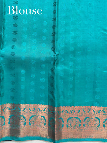 Kanchipuram Silk Handwoven by skilled artisans of Kanchipuram, this Kanjivaram saree in Red blends traditional elegance with intricate Pure Zari zari work. A truly stunning drape for special occasions. The interplay of colors and craftsmanship makes it a treasured piece for every saree connoisseur. Begada - Manoranjitham Weaves - Handloom Store