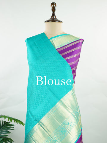 Kanchipuram Silk This Kanjivaram silk saree, adorned in Violet and detailed with Pure Zari weaving, reflects the grandeur of Kanchipuram. The timeless Buttis motifs enhance its bridal charm. A perfect blend of luxury and tradition, it is designed for those who appreciate fine craftsmanship. Sarasangi - Manoranjitham Weaves - Handloom Store