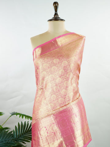 Kanchipuram Silk This Kanjivaram silk saree, adorned in Blush pink and detailed with Pure Zari weaving, reflects the grandeur of Kanchipuram. The timeless Buttis motifs enhance its bridal charm. A perfect blend of luxury and tradition, it is designed for those who appreciate fine craftsmanship. Sriranjani - Blush Pink Pure Kanjivaram Silk Saree | Pure Zari - Manoranjitham Weaves - Handloom Store
