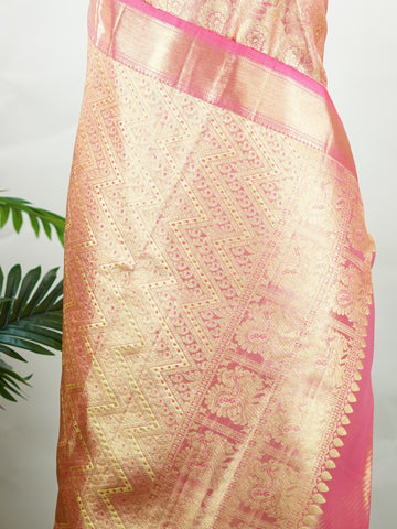 Kanchipuram Silk This Kanjivaram silk saree, adorned in Blush pink and detailed with Pure Zari weaving, reflects the grandeur of Kanchipuram. The timeless Buttis motifs enhance its bridal charm. A perfect blend of luxury and tradition, it is designed for those who appreciate fine craftsmanship. Sriranjani - Blush Pink Pure Kanjivaram Silk Saree | Pure Zari - Manoranjitham Weaves - Handloom Store