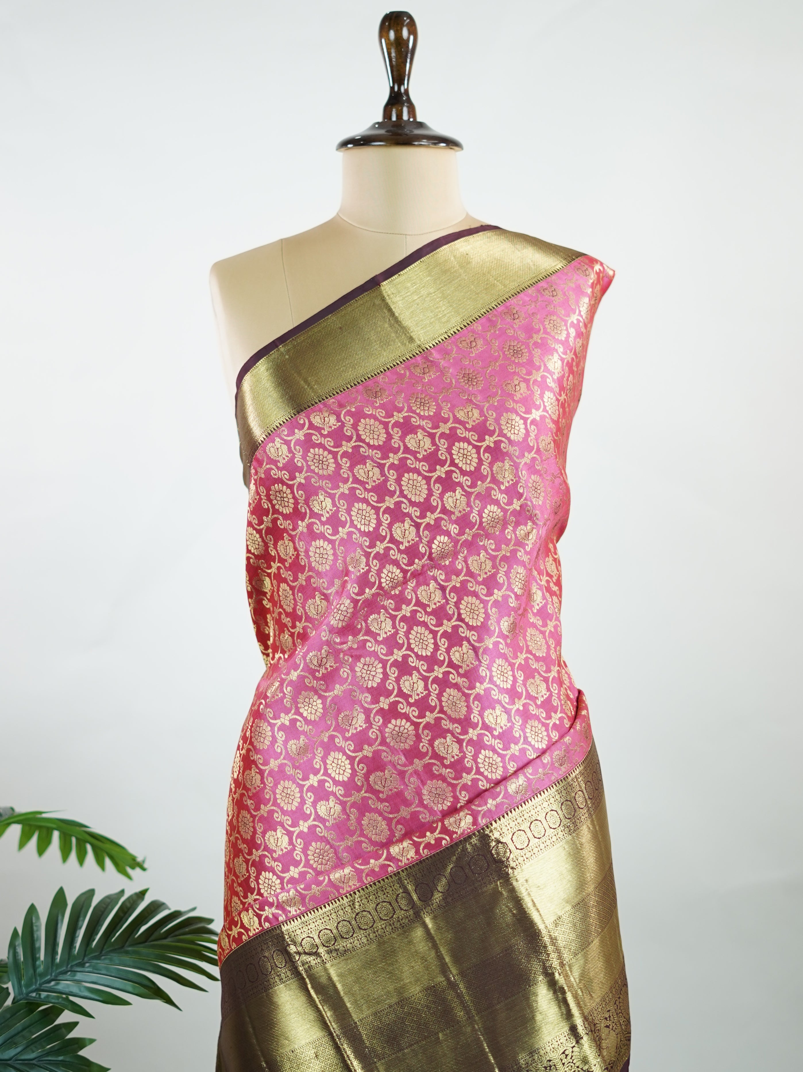 Kanchipuram Silk A masterpiece from Kanchipuram, this Kanjivaram saree in Soft pink  is a tribute to India's rich handloom legacy. The Pure Zari weaving and Buttis motifs make it a perfect choice for brides and celebrations. Every thread speaks of elegance, tradition, and the skilled hands that bring this saree to life. Keeravani - Pink Pure Kanjivaram Silk Saree | Pure Zari - Manoranjitham Weaves - Handloom Store