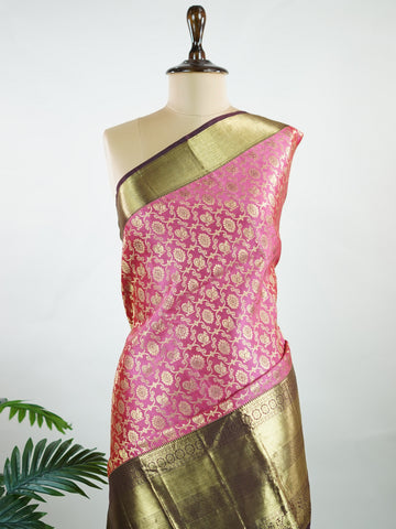 Kanchipuram Silk A masterpiece from Kanchipuram, this Kanjivaram saree in Soft pink  is a tribute to India's rich handloom legacy. The Pure Zari weaving and Buttis motifs make it a perfect choice for brides and celebrations. Every thread speaks of elegance, tradition, and the skilled hands that bring this saree to life. Keeravani - Pink Pure Kanjivaram Silk Saree | Pure Zari - Manoranjitham Weaves - Handloom Store