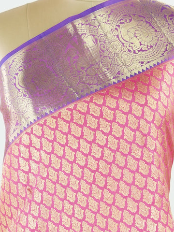 Kanchipuram Silk A masterpiece from Kanchipuram, this Kanjivaram saree in Hot Pink is a tribute to India's rich handloom legacy. The Pure Zari weaving and Buttis motifs make it a perfect choice for brides and celebrations. Every thread speaks of elegance, tradition, and the skilled hands that bring this saree to life. Bhairavi - Manoranjitham Weaves - Handloom Store